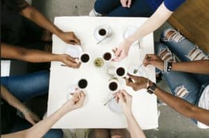 people of diversity drinking coffee, wondering about the impact on IBS and SIBO