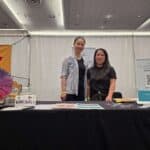 2 bc dietitians at a booth at the gluten free expo in Vancouver providing the community with resources and advice