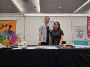 2 bc dietitians at a booth at the gluten free expo in Vancouver providing the community with resources and advice
